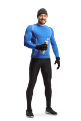 Full length portrait of a fit man in running clothes and a hat holding a drink bottle