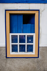 old window with blue shutters