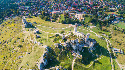 Medieval castle in the village of Olsztyn in the autumn scenery. 
Trail of the Eagles Nests (Szlak Orlich Gniazd). Krakow - Czestochowa Upland. Aerial view.