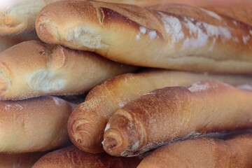 loaves of french baguette of bread oiled in a store display window