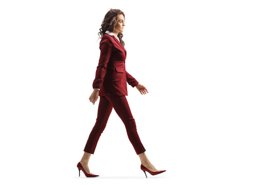 Full length profile shot of a young professional woman walking in high heels