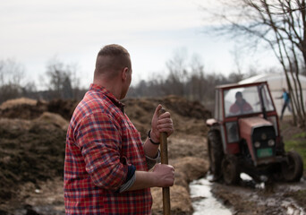 Farmer in natural manure field