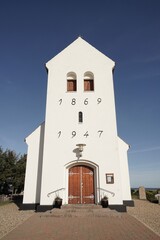 Haurvig Kirke on sunny day with blue sky, Jutland, Denmark