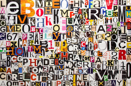 Colorful abstract collage from torn and peeling clippings with newspaper magazine letters and numbers. Alphabet letters cutting from shabby scratched paper magazine background. © Purple Moon