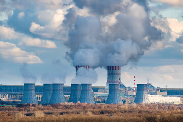 Nuclear power plant with Cooling tower with steam of Atomic power station. Industrial zone of...