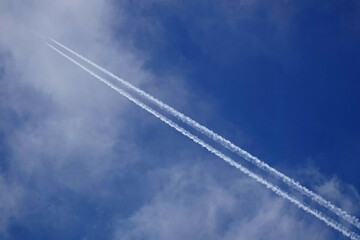 Contrail of a jet plane against a blue sky