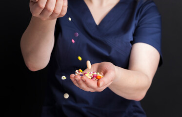 pills in the hands of a female doctor