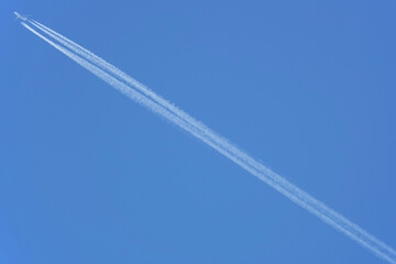 Contrail of a jet plane against a blue sky