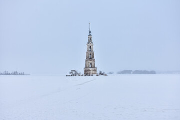 Bell tower in the middle of a frozen lake