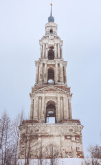 Bell tower in the middle of a frozen lake, close-up from below