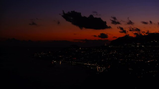 Sunset over the city of Funchal on Madeira island during a beautiful summer evening.