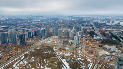 Naklejka na ściany i meble View of the city from above. Residential area in Minsk. Aerial view from drone in winter day. Urban concept.