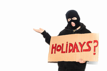Thief wearing a ski mask showing a cardboard sign on which the word 