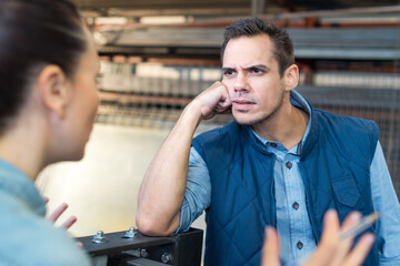 angry manager controlling employee in manufacturing plant