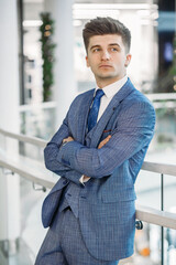 Man model in blue casual jacket and blue tie. Close-up