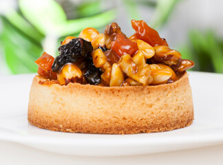 small round tartlet with a variety of fillings