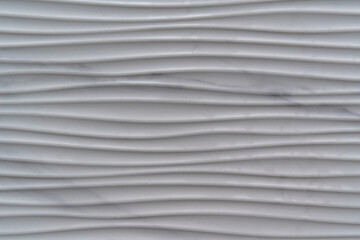 Illustration of a gray surface with uneven curved lines and black scratches