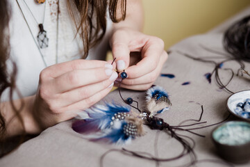 Obraz na płótnie Canvas Woman is making handmade gemstone jewellery