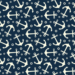 Obraz premium White ship anchors isolated on dark blue background. Cute marine seamless pattern. Vector simple flat graphic illustration. Texture.
