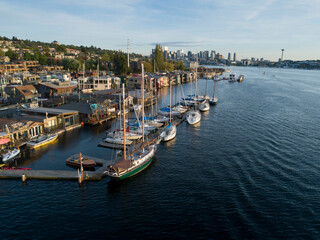 Fototapeta na wymiar Aerial view of sailboats and houseboats on Lake Union with downtown Seattle in the background.