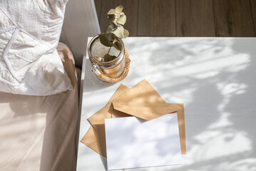 blank greeting card  invitation mockup with craft paper envelope  feminine still life composition