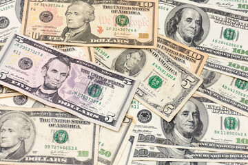 Many banknotes on a table. Dollars on the table. background with united states dollar bills.