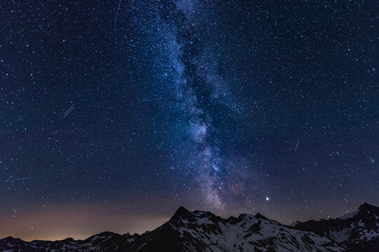 Scenic View Of Mountains Against Star Field At Night
