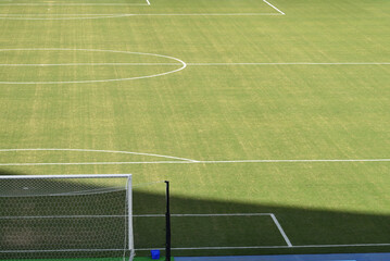 Green football field with nobody