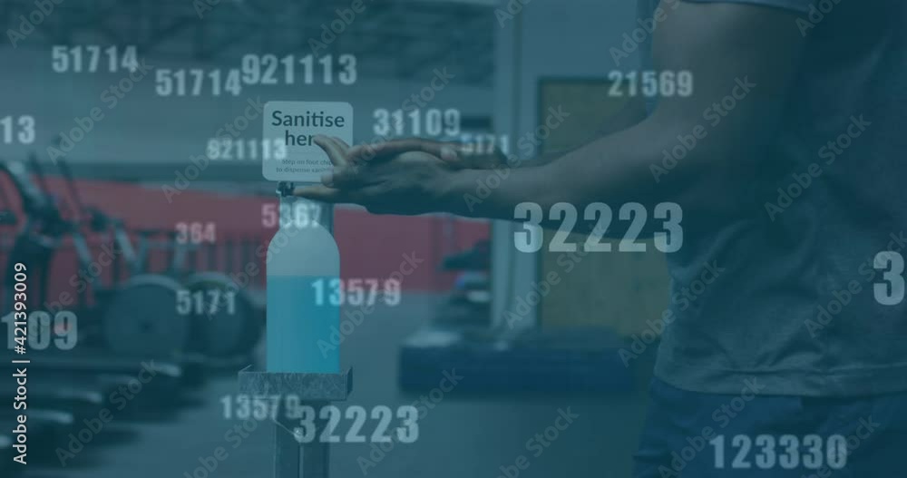 Poster multiple changing numbers against mid section of man using hands sanitizer at the gym