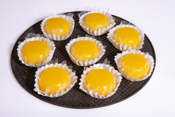 
Sweet quindim, of eggs and coconut, on a tray seen from above