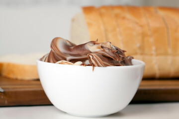 sliced white bread with sweet chocolate butter spread