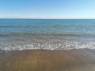 beach, sea, sand, water, ocean, wave, sky, coast, waves, blue, nature, summer, shore, landscape, vacation, tropical, foam, travel, horizon, coastline, seascape, outdoor, holiday