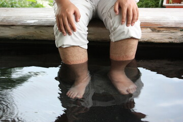 Man's Foot in Foot Bath or Foot Spa at Kaminoyama Onsen, Hot Spring, in Yamagata, Japan - 日本 山形 上山城 足湯に入る男性