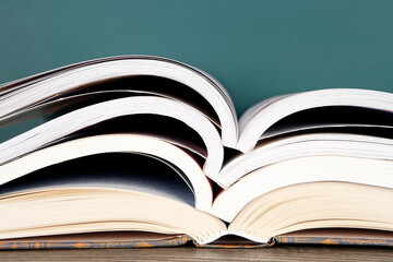 A stack of open books