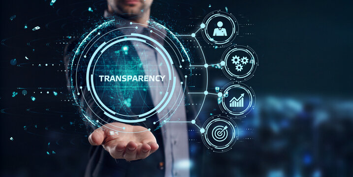 Business, Technology, Internet and network concept. Young businessman working on a virtual screen of the future and sees the inscription: Transparency