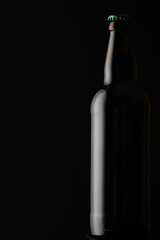 Stylish bottle on dark background