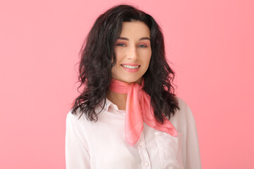 Portrait of young woman with beautiful curly hair on color background