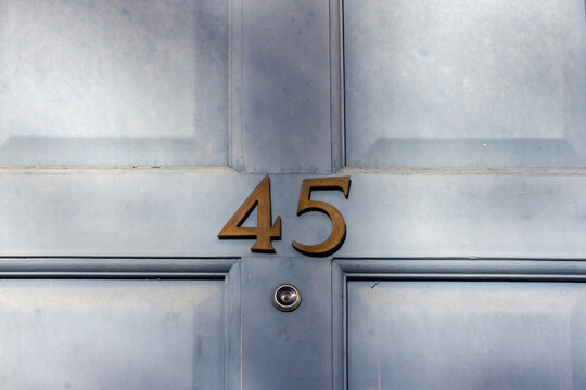 House Number 45 On A Light Blue Wooden Front Door In London