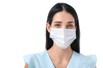 Young woman wearing medical mask on white background