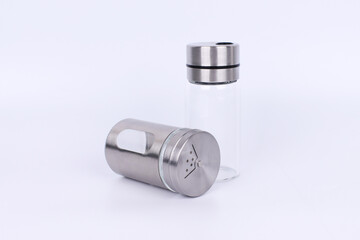 Stainless steel seasoning container on white background