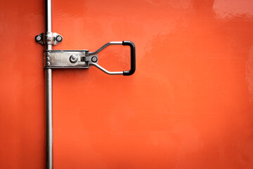 Red Steel Door Safety lock of Cargo Truck with Texture Copy Space.