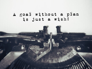 Inspirational and Motivational Concept - 'A goal without a plan is just a wish' with vintage background. Stock photo.