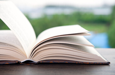 Books opened in front of the window