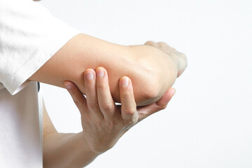 Men use their hands to hold their elbows and He had pain at the elbows.. Painful Health and medical concepts