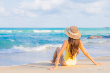 Portrait beautiful young asian woman relax smile leisure around beach sea ocean