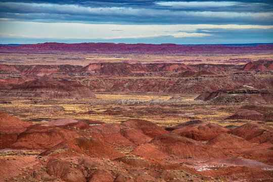 dramatic landscape photo of the Painted Desert in the Petrified Forest National Park in Arizona. The Painted Desert is known for its brilliant and varied colors.