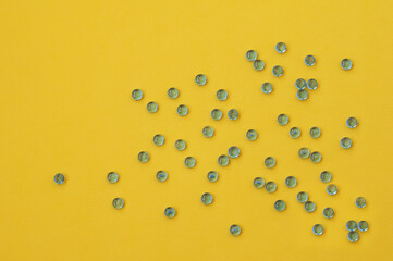 blue beads on yellow background
