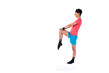 A young guy in shorts and a T-shirt goes in for sports and fitness. Retro style. 80s, 90s, 70s. Isolate. White background.