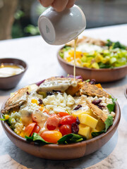 Cafe - Salad bowl with variety of vegetable, beans, salad cream