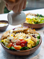 Cafe - Salad bowl with variety of vegetable, beans, salad cream
